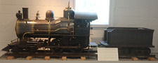 The 1905 Cagney Model D Locomotive is a large black train with gold detailing