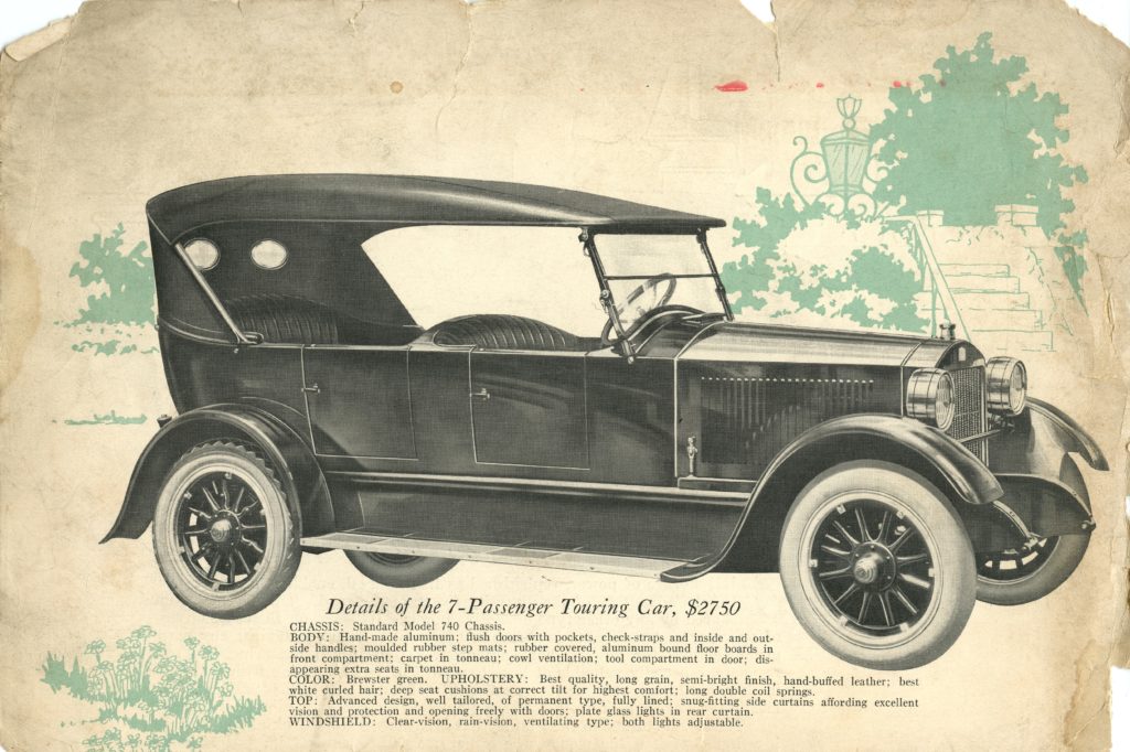 An ad for the 1922 Stanley Model 740, it features a side profile ofht ecar and there are green leaves drawn behind the car 