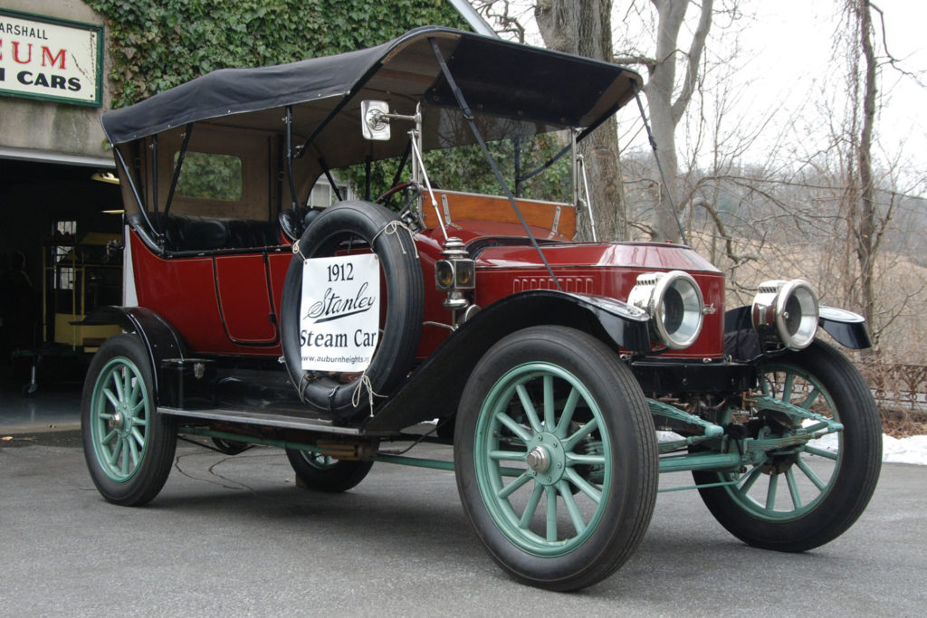 The The 1912 Stanley Model 87 as it looks today has a red body, with a mint green undercarriage and wheel spokes, and there is a top over the car