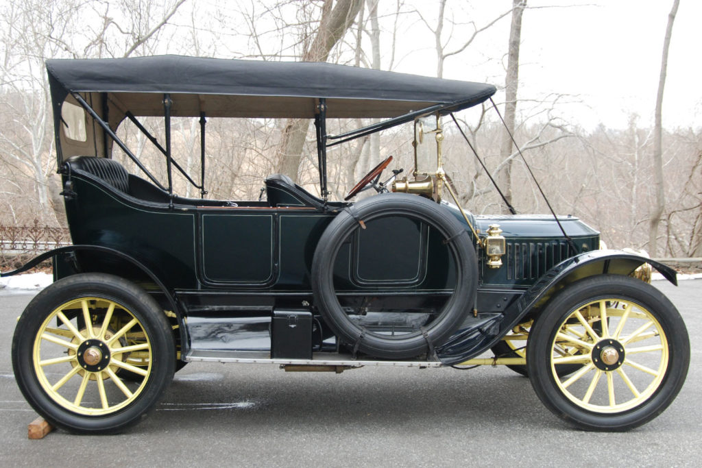 The 1913 Stanley Model 76 has a black top, with a blue body, and yellow wheels and undercarriage