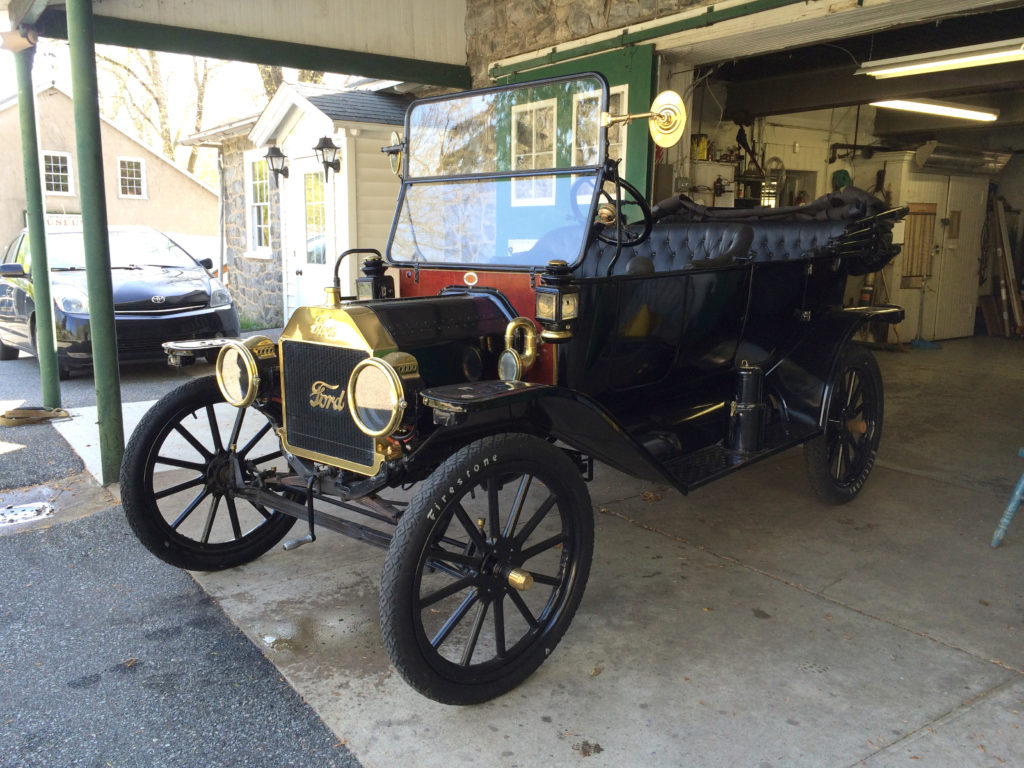The model T is parked in front of the Marshall Steam Museum's garage