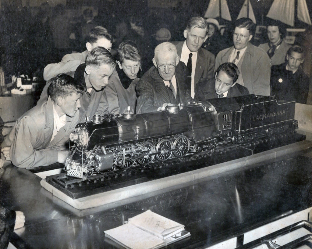 Several men are standing behind the 4-8-4 Pocono (Northern) Lackawanna, one of whom is Clarence Marshall